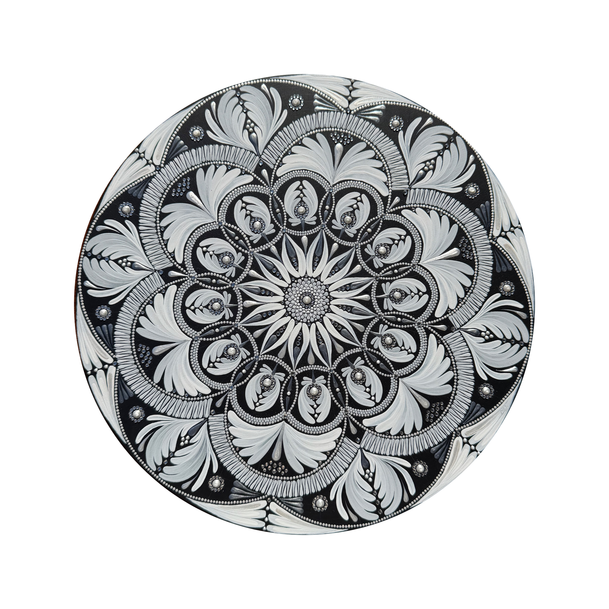 Decorative mandala with intricate black and white floral pattern on a white background